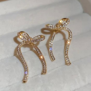 Σκουλαρίκια σε Σχέδιο Φιόγκου Χρυσό Ατσάλι με Στρας